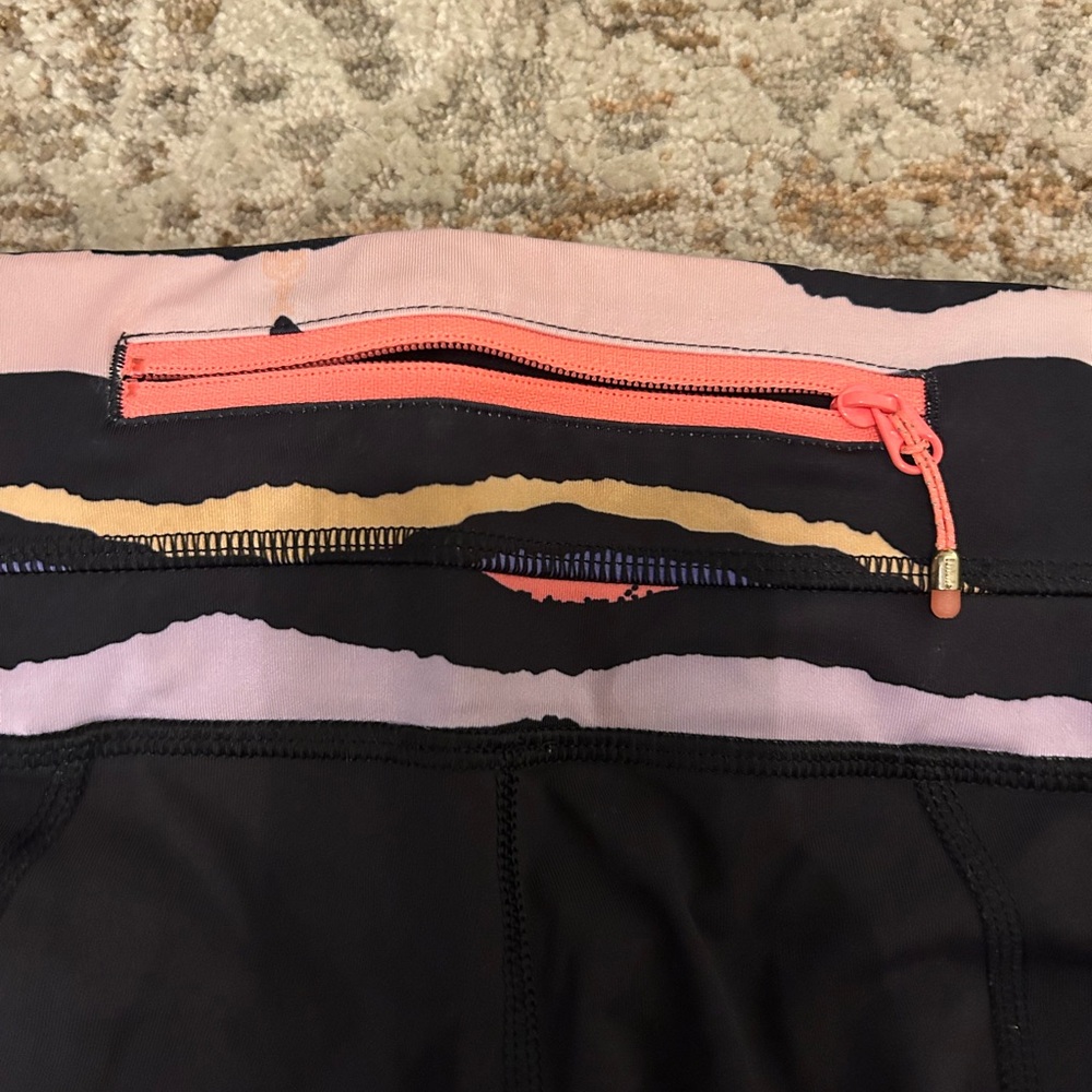 Lulu lemon black leggings with fun minimal design on band and bottom - Picture 3 of 4